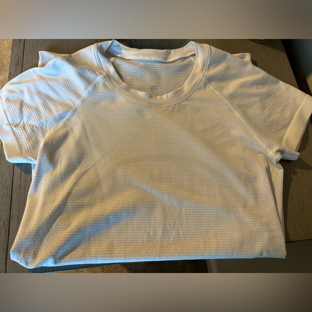 WHITE lululemon swiftly tech in size 4